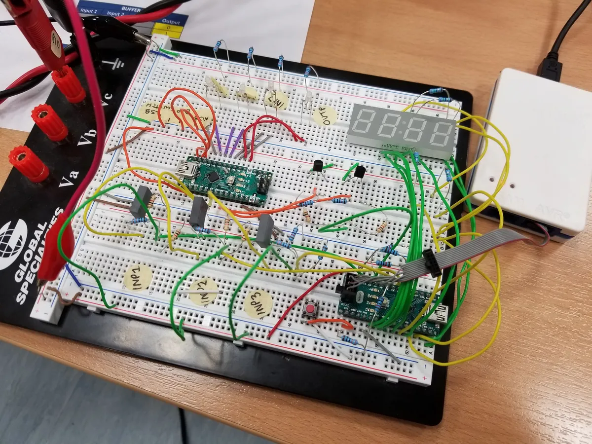 Breadboard prototype with Arduino Nano, 7-segment display, and logic gate ICs
