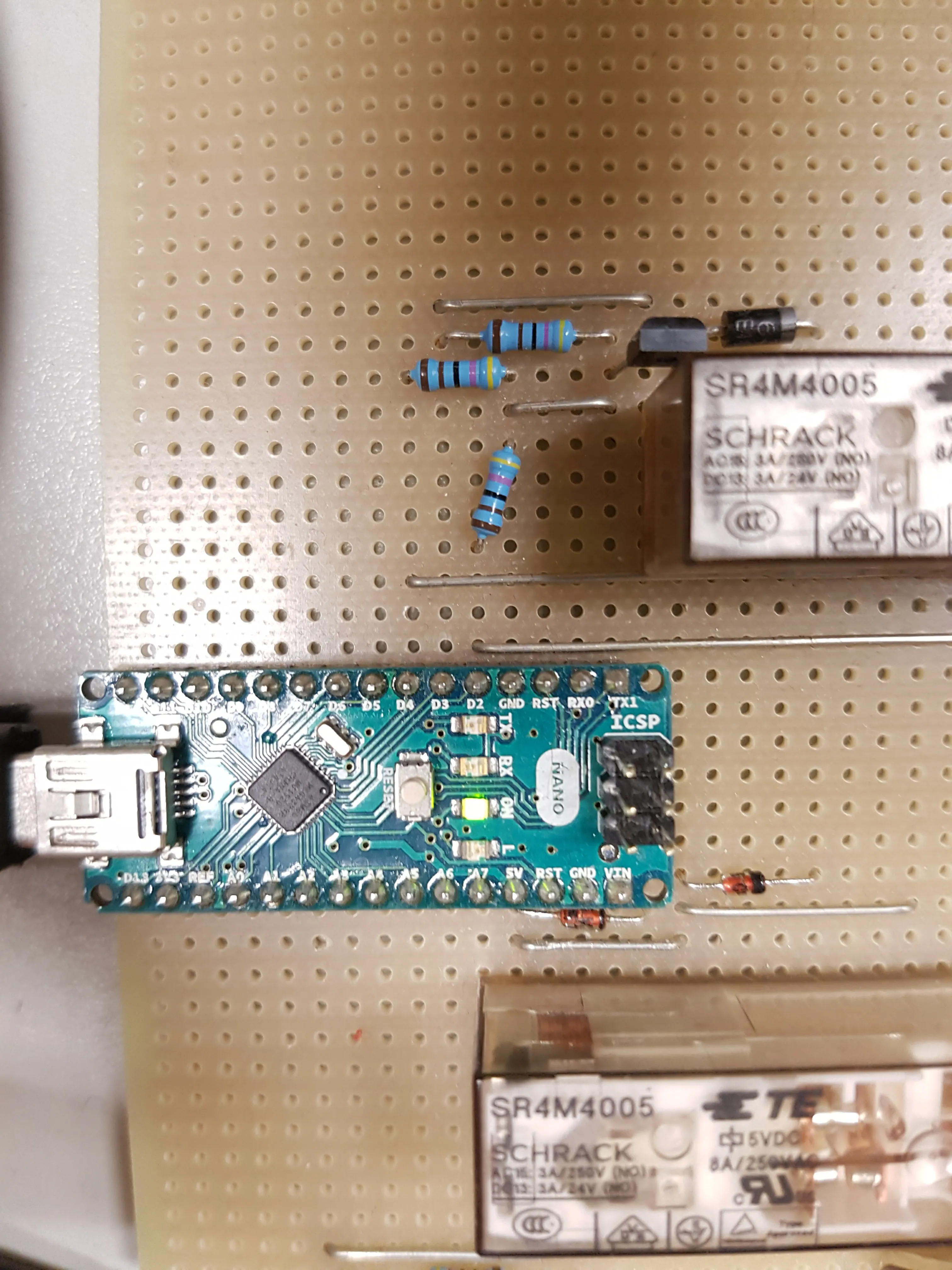 Early prototype on stripboard with an Arduino Nano and Schrack relays