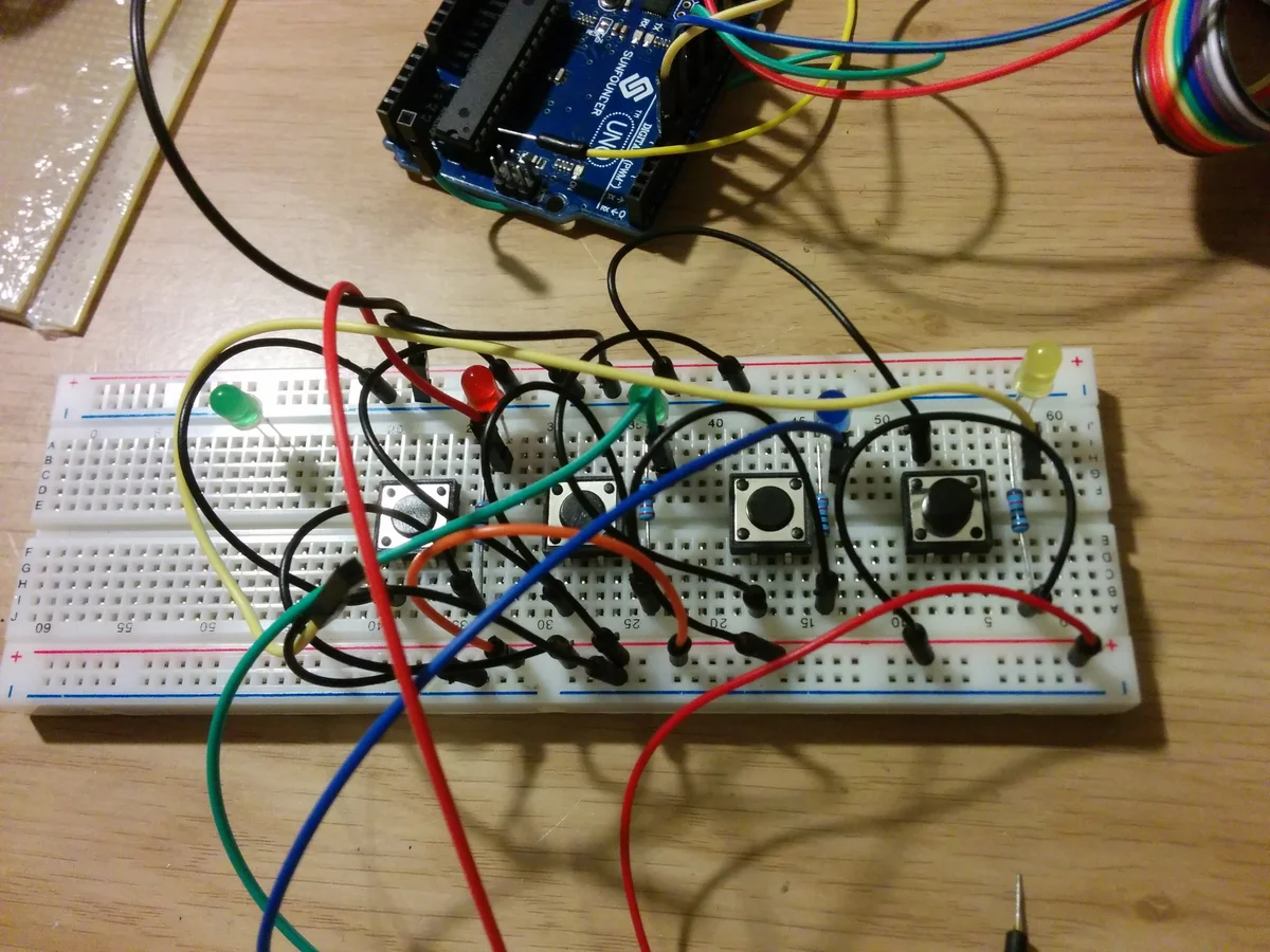 Arduino Uno connected to tactile switches on a breadboard, early prototype of the Simon Says game