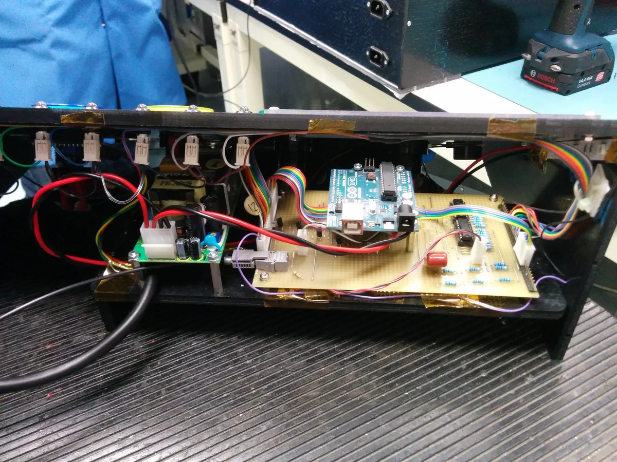 Internal wiring of the enclosure showing Arduino, relay board, and cable routing