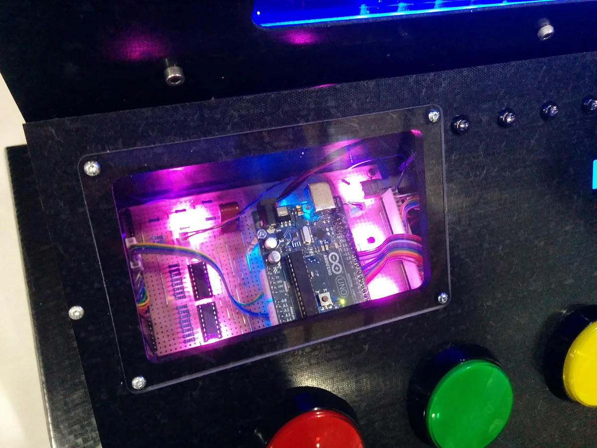 Acrylic window showing Arduino and LED-lit electronics inside the enclosure
