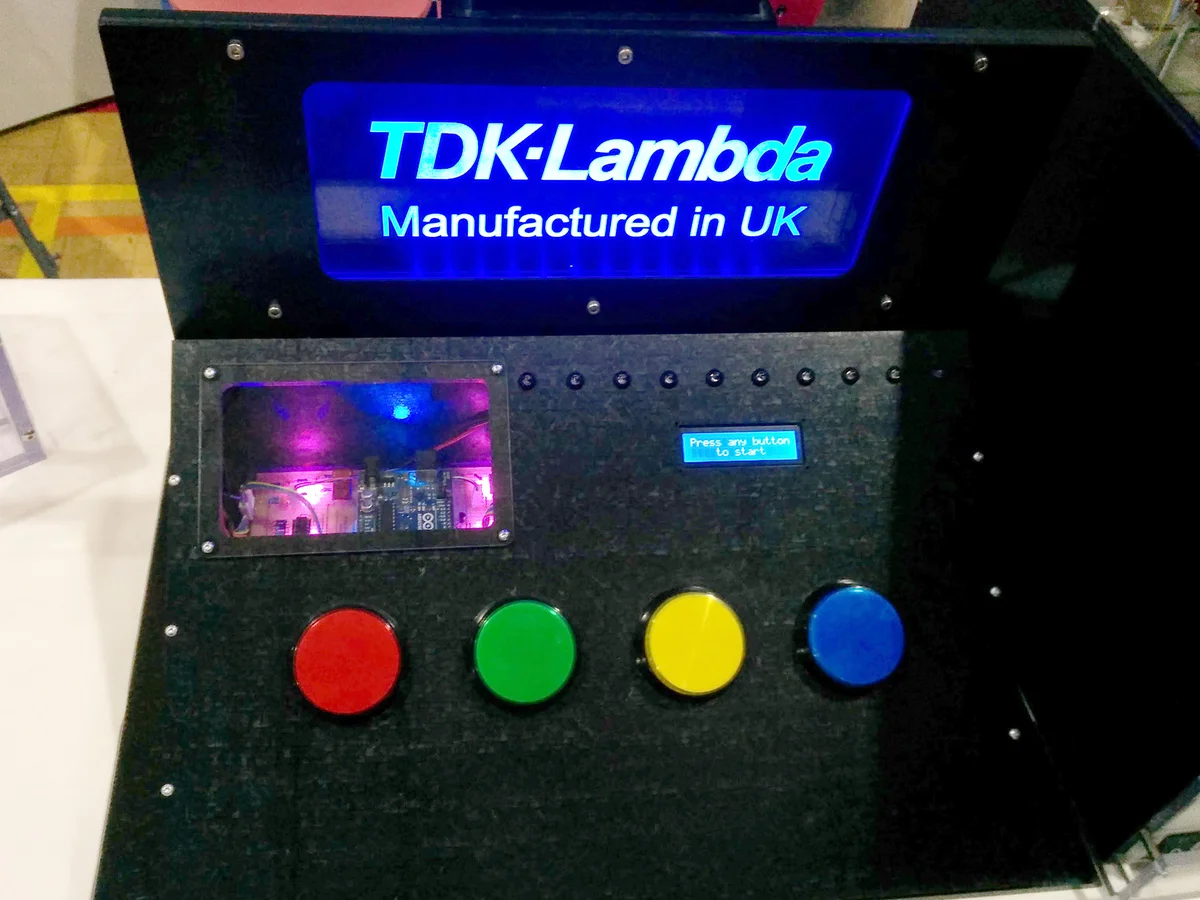 Simon Says game being played, showing coloured arcade buttons lighting up in sequence