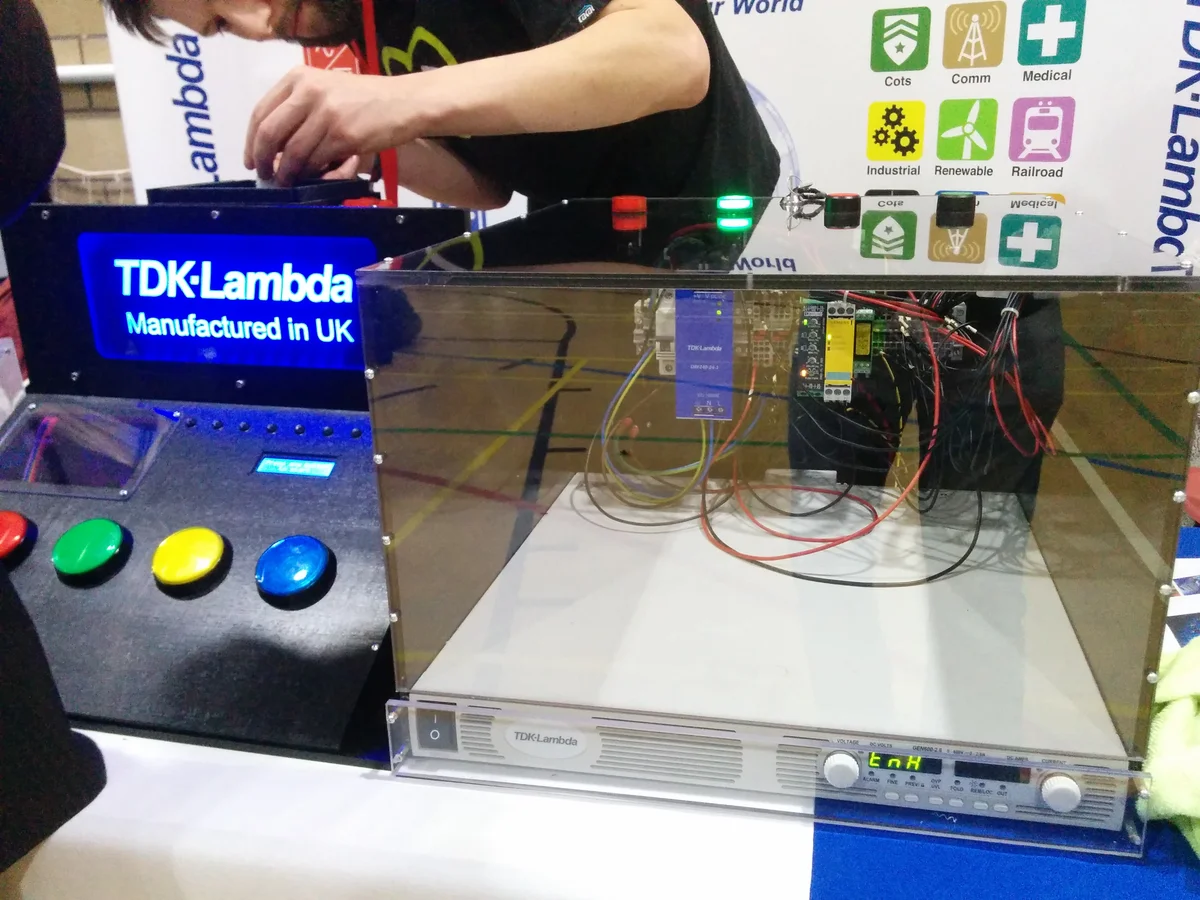 Complete exhibit setup showing Simon Says game alongside the capacitor discharge demonstration unit